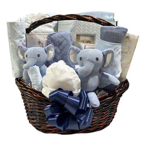 Boy Baby Gift Basket Bundle featuring soft blue elephant plush toys, baby clothes, blankets, and keepsakes in a dark wicker basket with a navy blue bow, perfect for Canadian gift delivery.