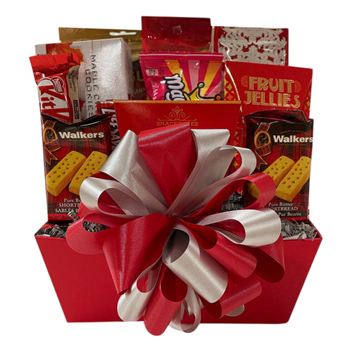 Celebrate Gift Basket featuring an assortment of gourmet treats including cookies, chocolates, fruit jellies, and shortbread, adorned with a festive red and white ribbon bow.