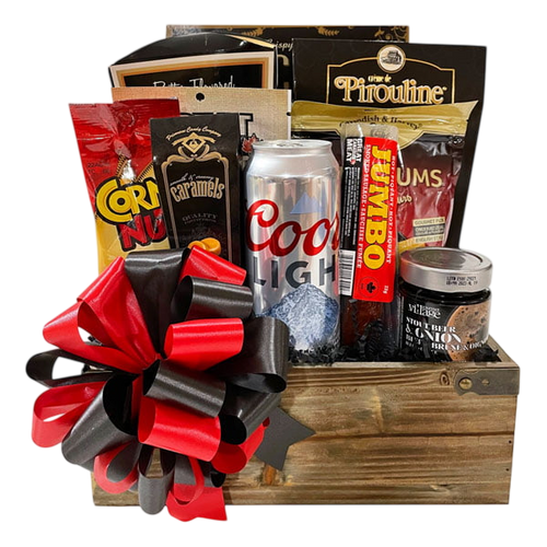 Busy Man's Gift Basket featuring a wooden box filled with assorted gourmet snacks, chocolates, beef sticks, caramel, popcorn, and a can of beer, adorned with a red and black bow.