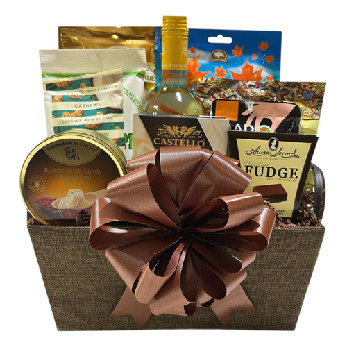 Canadian Gluten Free Wine Gift Basket featuring a chilled bottle of white wine, gluten free snacks including fudge, cashews, cookies, and gourmet treats, elegantly presented with a large brown ribbon bow. Cherished Gift Baskets delivers premium, handpicked gift baskets across Canada for birthdays, corporate gifts, and special occasions. Gifts That Speak from the Heart.
