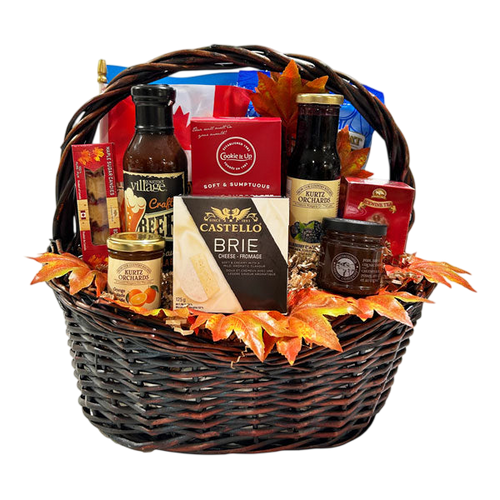 Canadian Gourmet Gift Basket – Maple, Icewine & Local Flavours with assorted gourmet cheese, cookies, preserves, sauces, and local Canadian treats in a decorative basket, perfect for gift delivery Canada by Cherished Gift Baskets.